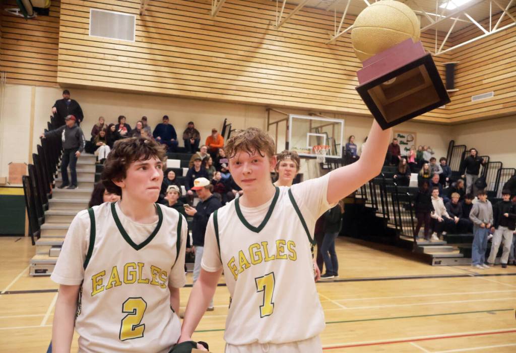 Blaine Bracey and Cole Dagilis celebrate winning the fourth annual at the South Cariboo Winter Classic. (Misha Mustaqeem photo - 100 Mile Free Press)
