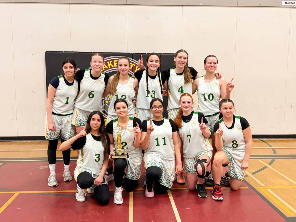 The PSO Eagles Junior Girls celebrate their victory in Williams Lake on Saturday, Feb. 7. (Rick Barker photo)