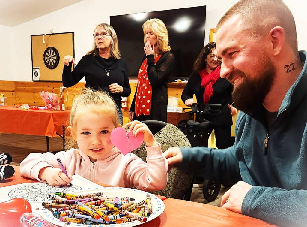 Thora and her dad Kurtis Boylan were visiting her grandparents and went to the Valentine&rsquo;s Potluck at the Green Lake Community Centre on Feb. 14. When Thora arrived, she got busy colouring. (Ken Alexander photo)