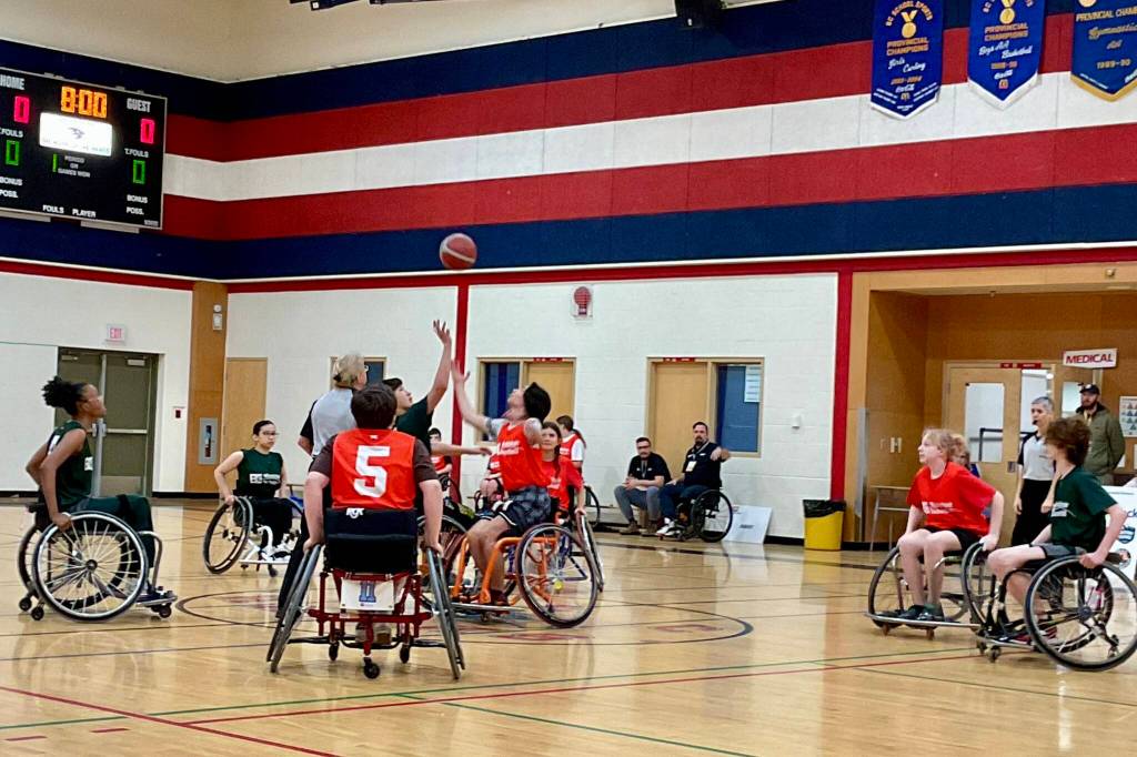 Thompson-Okanagan (red) takes on Vancouver-Coastal during wheelchair basketball action Friday at noon in the J.L. Crowe Secondary School gym as part of Trail-Rossland 2026 BC Winter Games. (Sheri Regnier/Trail Times)